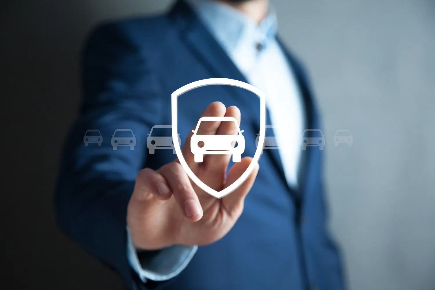Car insurance shield shown over a line of vehicles